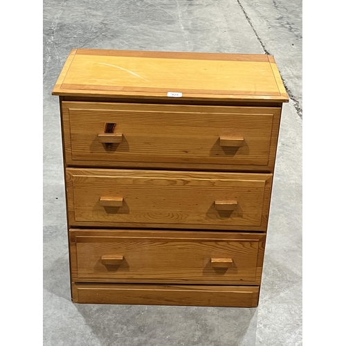 428 - A pine chest of three drawers. 25