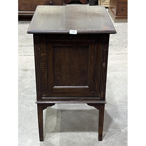 430 - A 1920s oak record cabinet with fall front. 18½