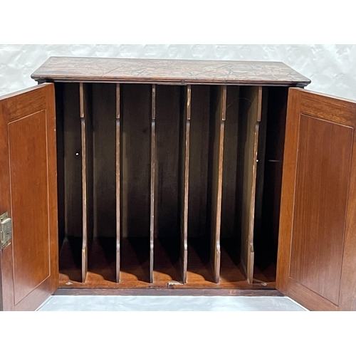 431 - A 19th Century mahogany music cabinet, 23