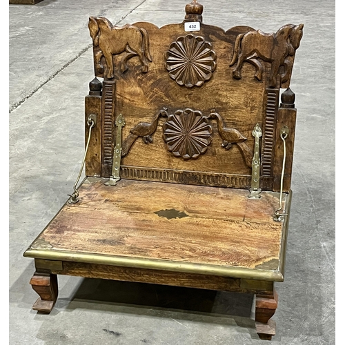 432 - An Indian carved hardwood and brass mounted seat with hinged back. 22