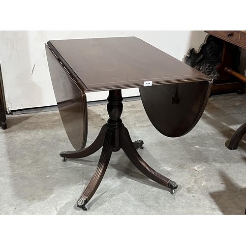 434 - A drop leaf Regency style dining table of recent manufacture. 36