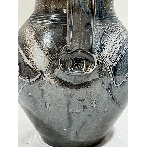 222 - MICHAEL CASSON, OBE. BRITISH 1925-2003. A salt glazed jug with incised line decoration. Impressed mo... 