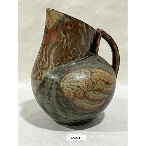 223 - A Mick Morgan pottery ewer in the form of a stylised cockerel. 9½