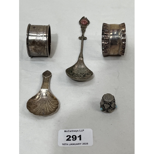 291 - Two silver napkin rings, a silver caddy spoon and a silver thimble with turquiose cabochons. 1ozs 10... 