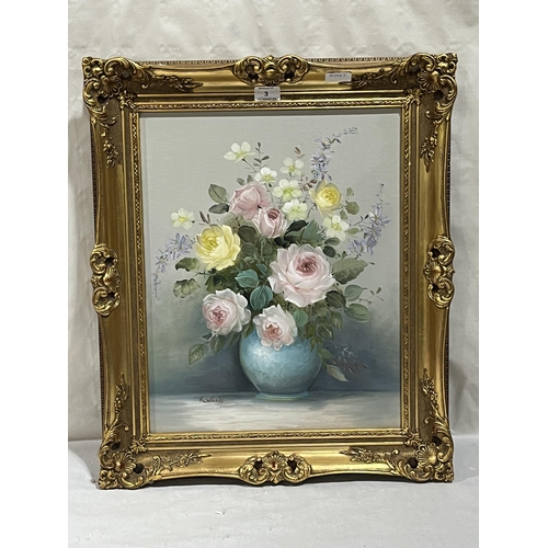 3 - A gilt framed still life oil painting of roses in a vase. 20