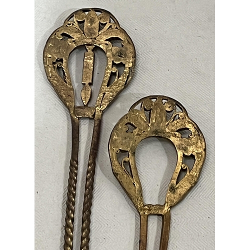 308 - A pair of yellow metal hairpins set with old cut white stones. 5¼