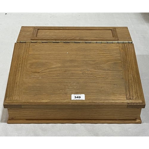 349 - An oak writing box with sloping fall. 15½