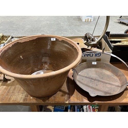 36 - A large earthenware dairy bowl and a cast iron inglenook pan