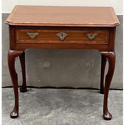 386 - A George II walnut and crossbanded side table, the moulded top with re-entrant corners, over a friez... 