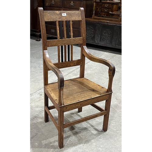 399 - An early 19th century joined oak armchair