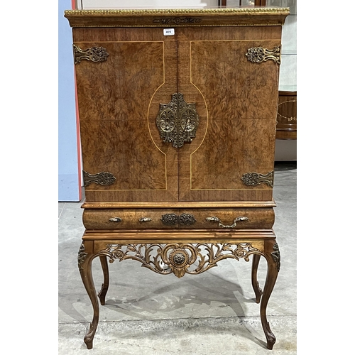 405 - An French Empire style burrwood, crossbanded and inlaid cocktail cabinet with fitted interior over a... 