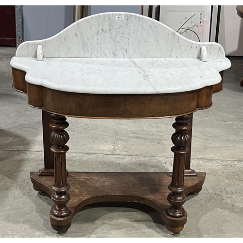 411 - A Victorian mahogany washstand with marble top and splashback. 42