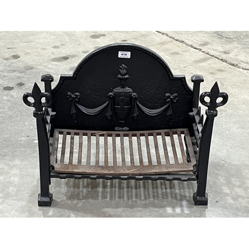 419 - A cast iron fire grate. 20