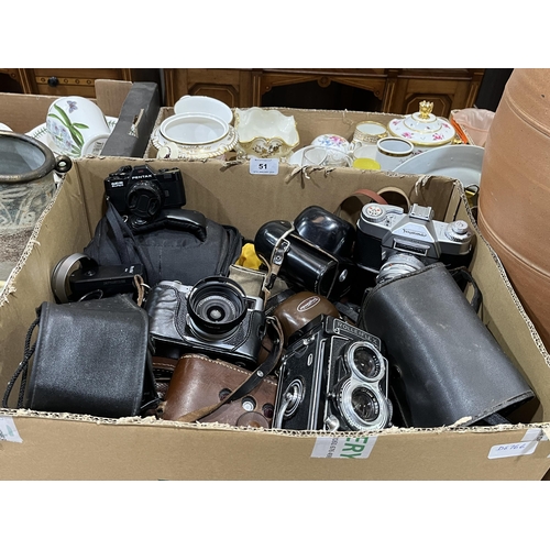 51 - A box of cameras and accessories