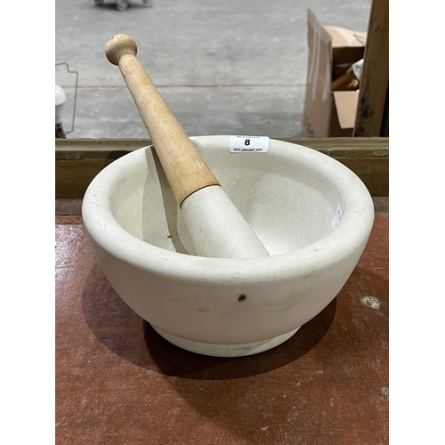 8 - A large pestle and mortar. 9½