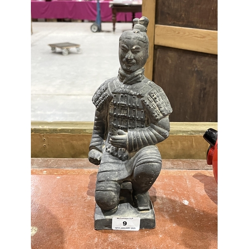 9 - A Chinese terracotta warrior souvenir statuette. 10¾