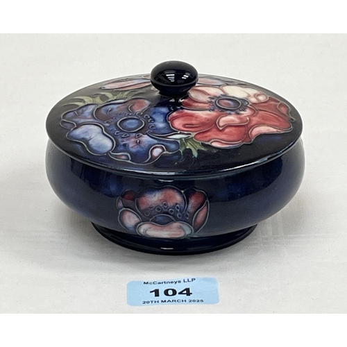 104 - A Moorcroft Anemone pattern tube-lined powder jar and cover. 4½