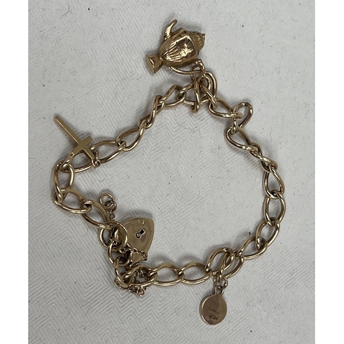 112 - A 9ct bracelet with three charms and locket clasp. 10g