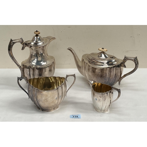 115 - A George V silver four piece tea service comprising of a teapot, hot water jug, sucrier and milk jug... 