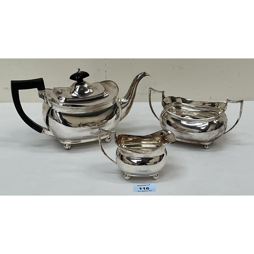 116 - A George V silver three piece tea service comprising of a teapot, sucrier and milk jug. Chester 1919... 