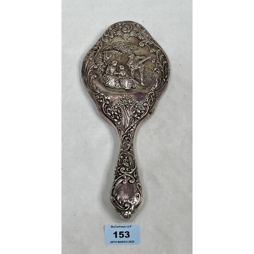 153 - A Victorian silver repousse hand mirror. Birmingham 1899. Loaded