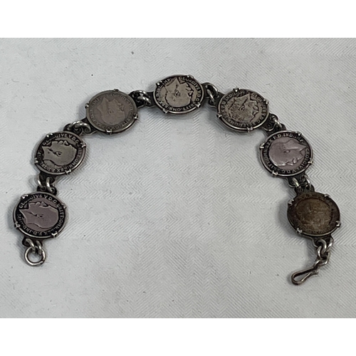 157 - An early 20th century silver child's bracelet, the links with seven three penny bit coins (five pre-... 