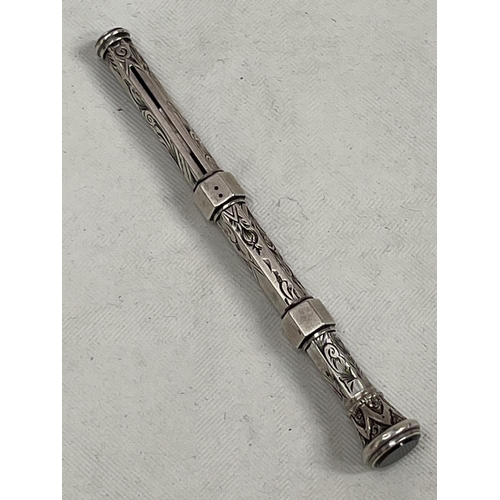 193 - A Victorian white metal propelling pen/pencil with hardstone seal top. 4¼