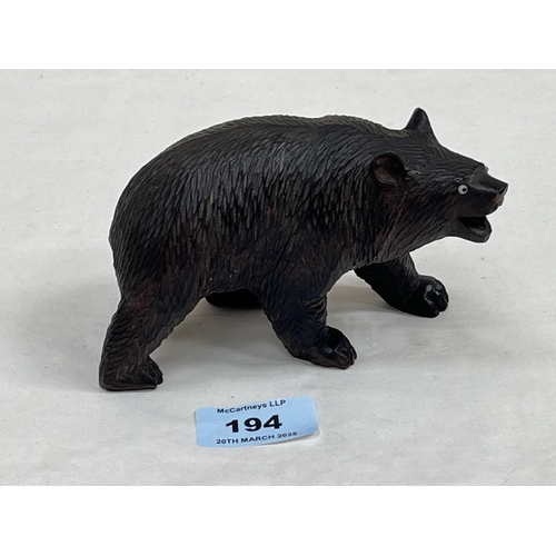 194 - A Black Forest carved wood bear. 5