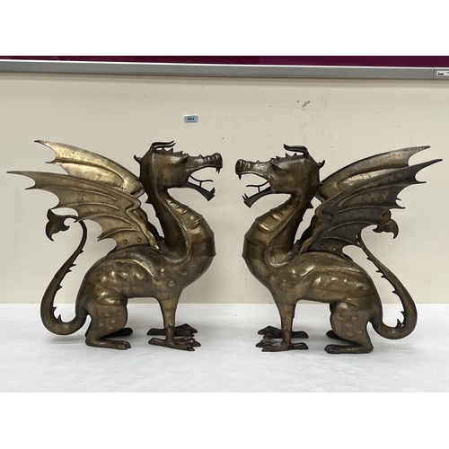 203 - A pair of heavy brass Welsh dragon ornaments. 21