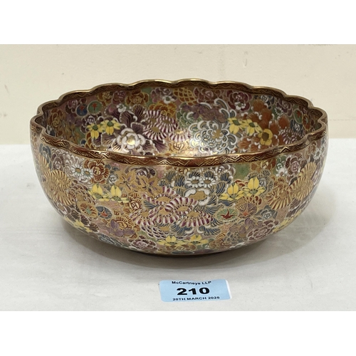 210 - A Japanese satsuma bowl by Futaji, profusely decorated with polychrome flowers. Signed . 7