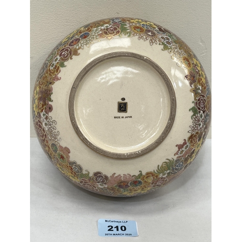 210 - A Japanese satsuma bowl by Futaji, profusely decorated with polychrome flowers. Signed . 7