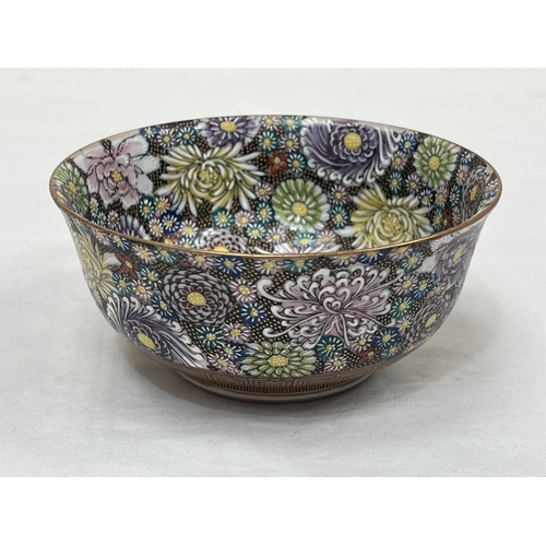 211 - A Japanese satsuma millefiore bowl, profusely decorated with polychrome flowers. Signed. 4¾