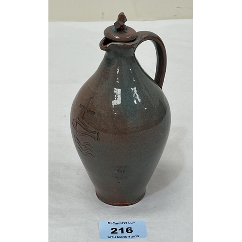 216 - A glazed terracotta communion wine flask and stopper. 6½