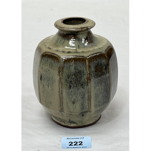 222 - MIKE DODD. BRITISH Bn. 1943 A faceted high glazed stoneware green vase. 5½