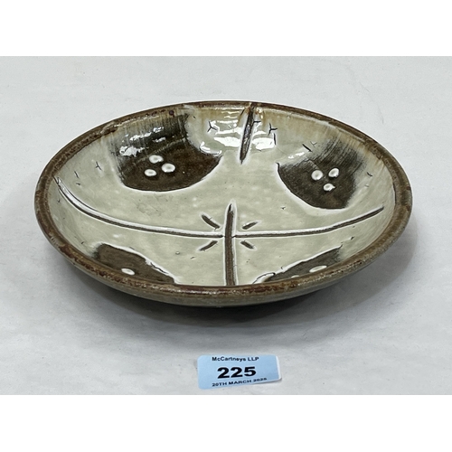 225 - MIKE DODD. BRITISH Bn. 1943 A high glazed studio pottery shallow dish. Artist's seal. 8