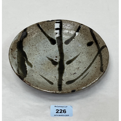 226 - WILLIAM (BILL) MARSHALL. BRITISH 1923-2007 A St.Ives, Cornwall studio pottery dish with a green glaz... 