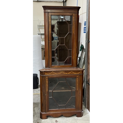 471 - A 19th century mahogany and inlaid astragal glazed standing corner cupboard. 78