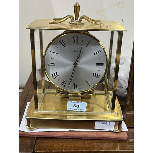 50 - A Kundu brass four glass electric mantle clock. 8