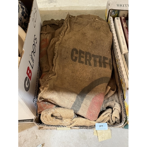 85 - A box of hessian seed bags