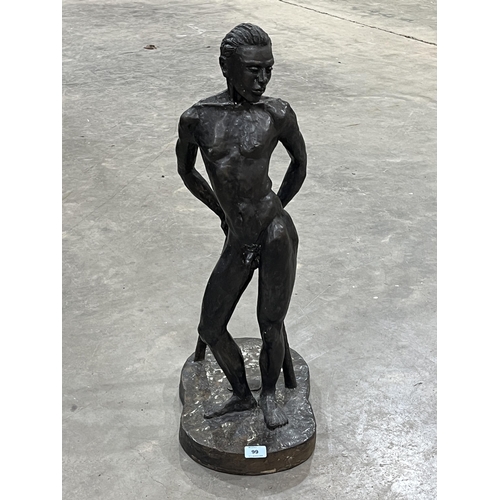 99 - A bronzed composition figure of a male nude with two sticks. Signed N. Barrow and dated 1988. 30