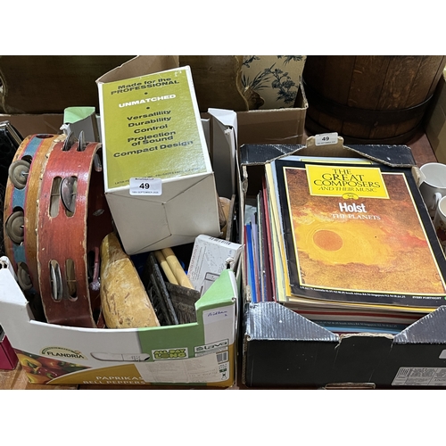 A box of musical instruments and a box of The Great Composers magazines