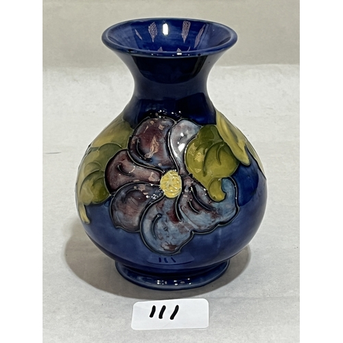 111 - A Moorcroft clematis pattern tube-lined baluster vase. Impressed mark. 5¼in high