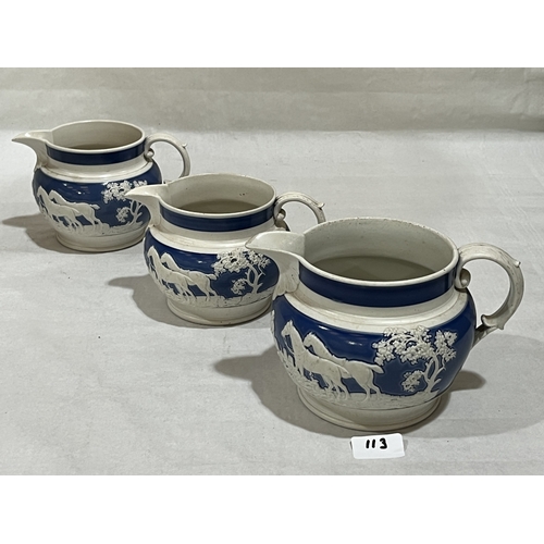 113 - Three 19th century blue and white jugs, each with a continuous sprigged hunting scene. 5in high and ... 