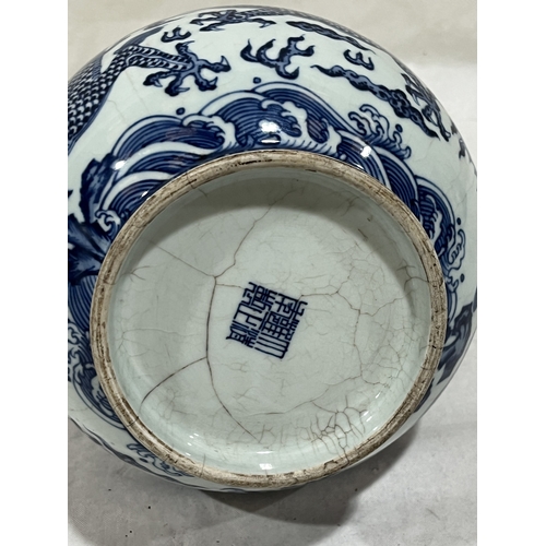 164 - A Chinese blue and white glazed dragon vase. 10¾in high. Numerous cracks