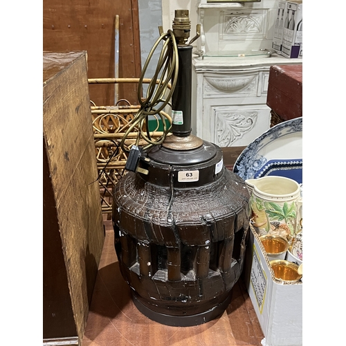 63 - A table lamp modelled as a cart wheel hub in fibreglass