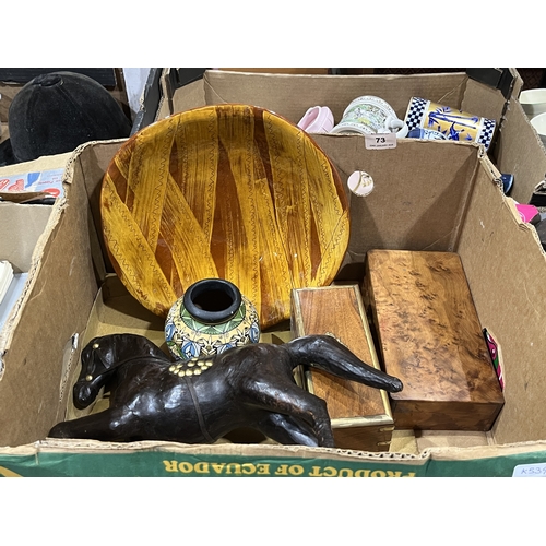 73 - A slip glazed bowl, a leather horse, vase and two treen boxes