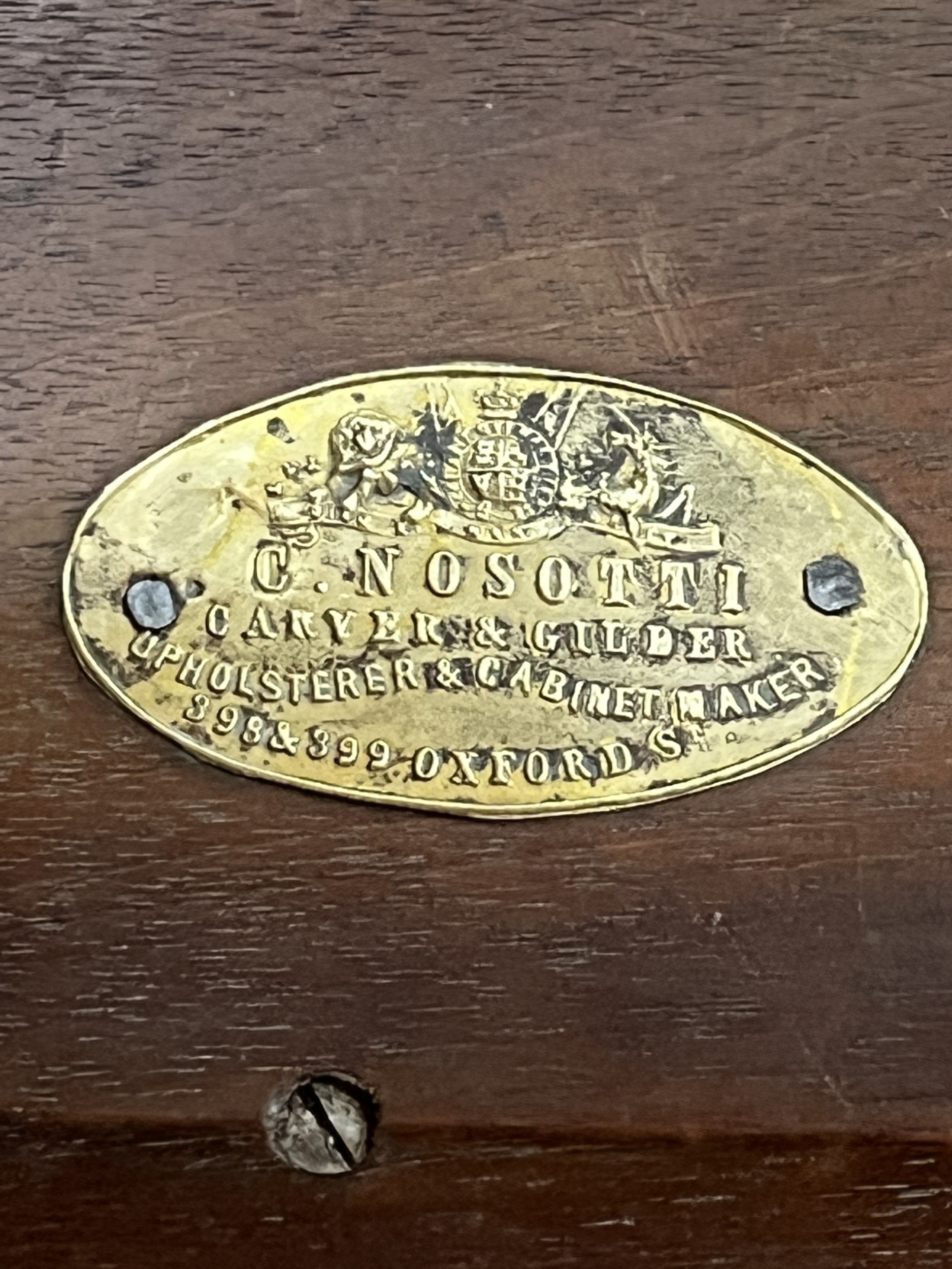 A 19th century rosewood and parcel gilt music stool, bearing a brass ...