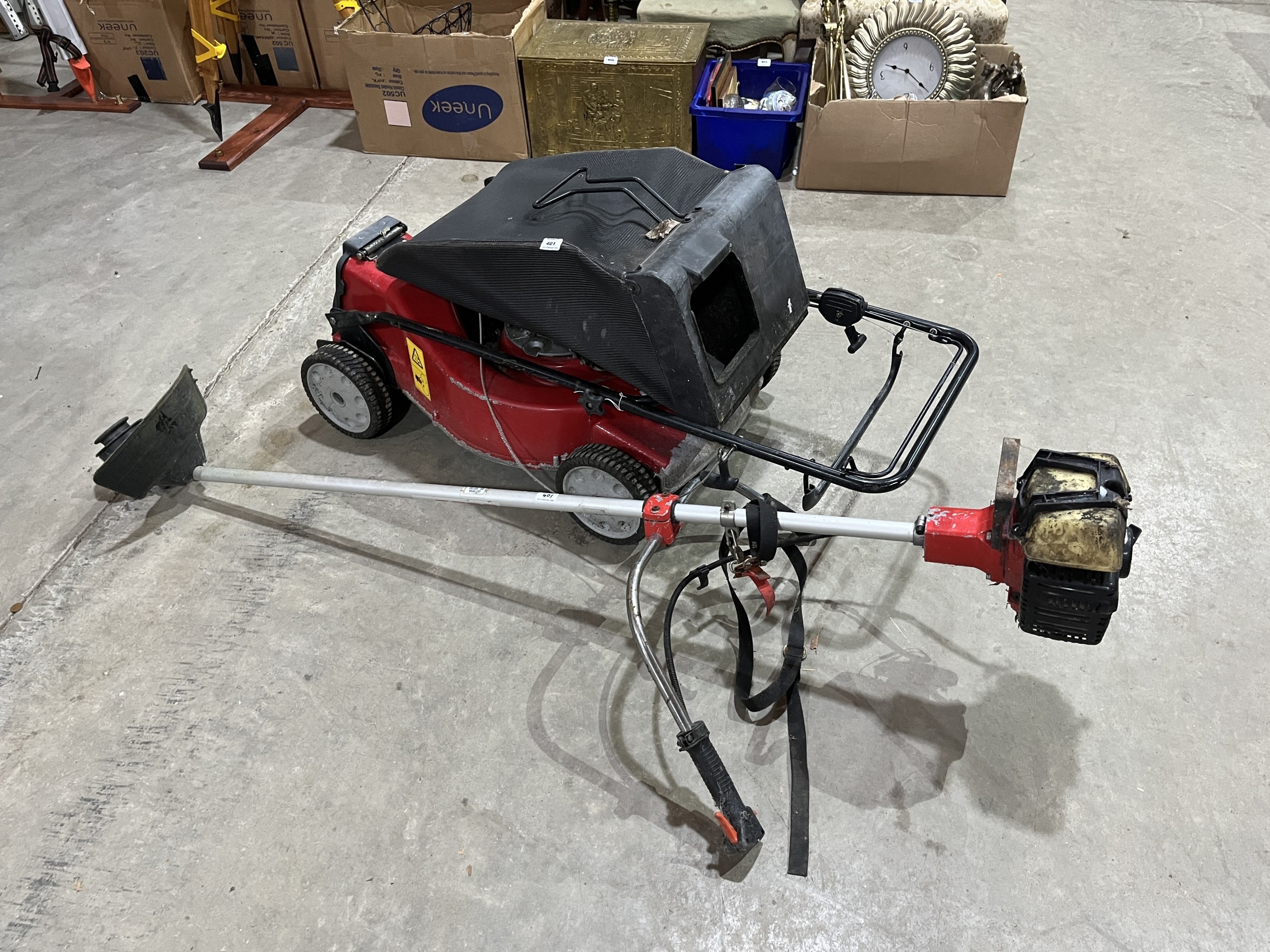 An Intek 6.5hp motor mower and a petrol strimmer