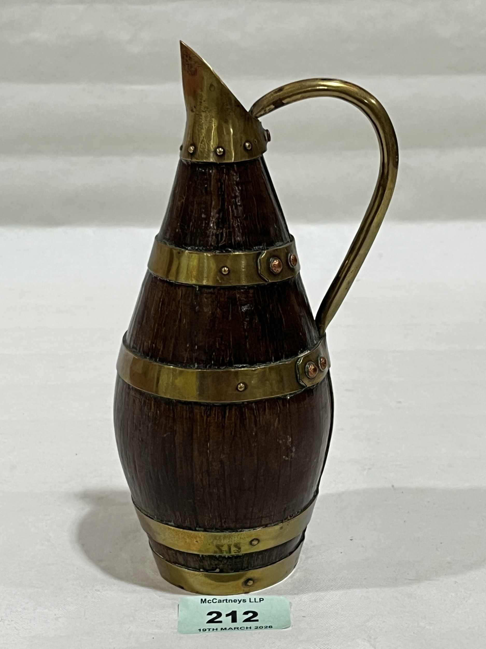 An oak and brass coopered ewer. 7½in high