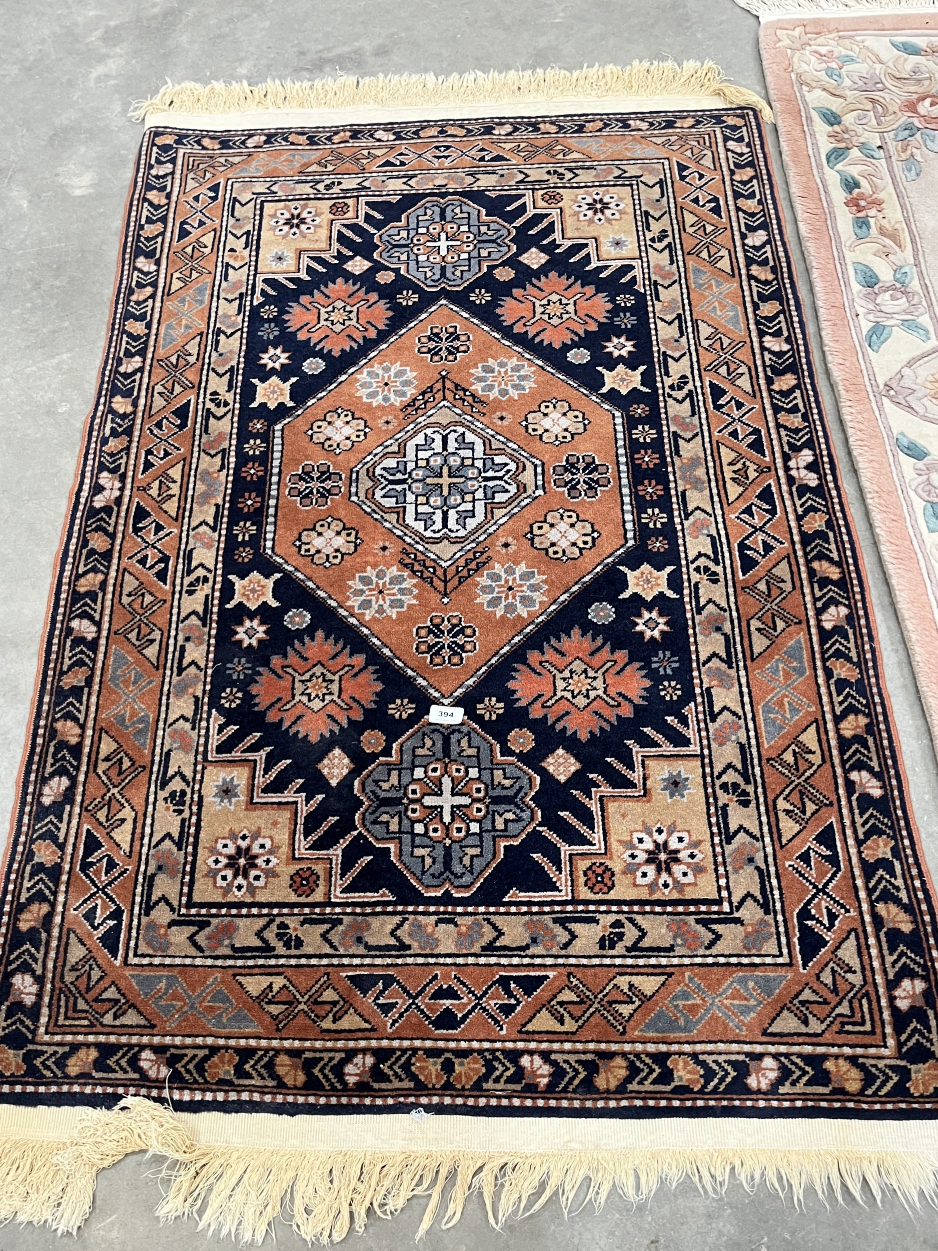 A Middle-eastern rug, 59in x 39in